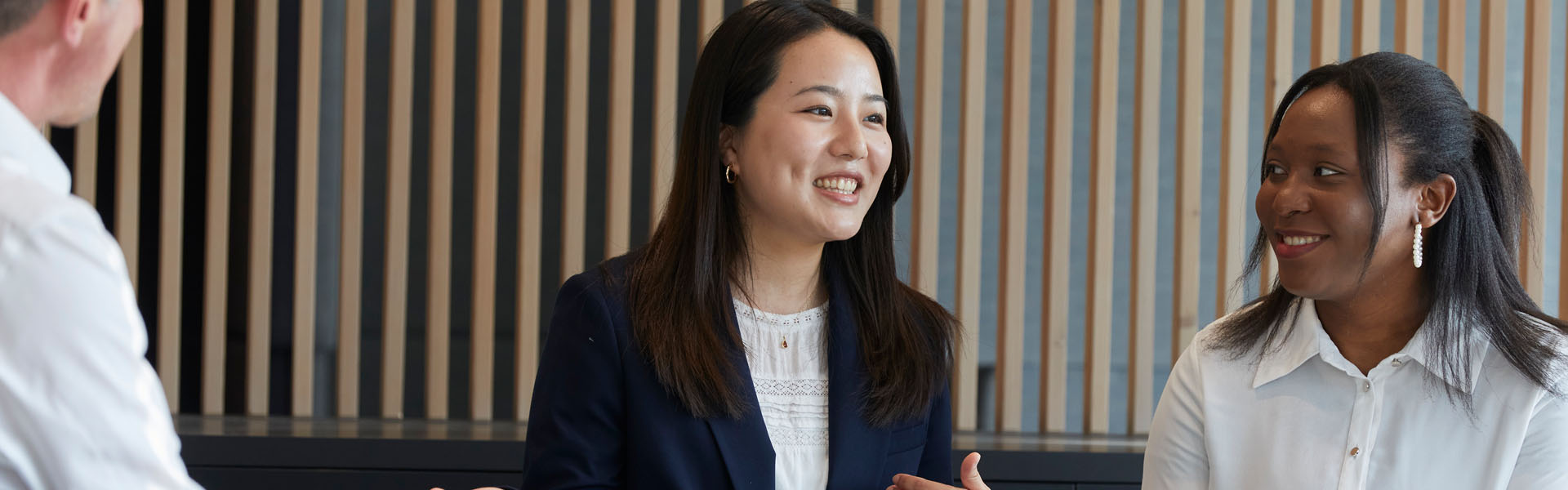 SMBC Employee on laptop in conference room